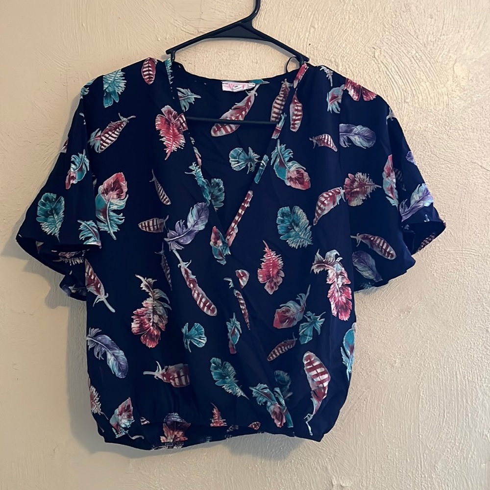 Dark blue v neck blouse with colorful feathers